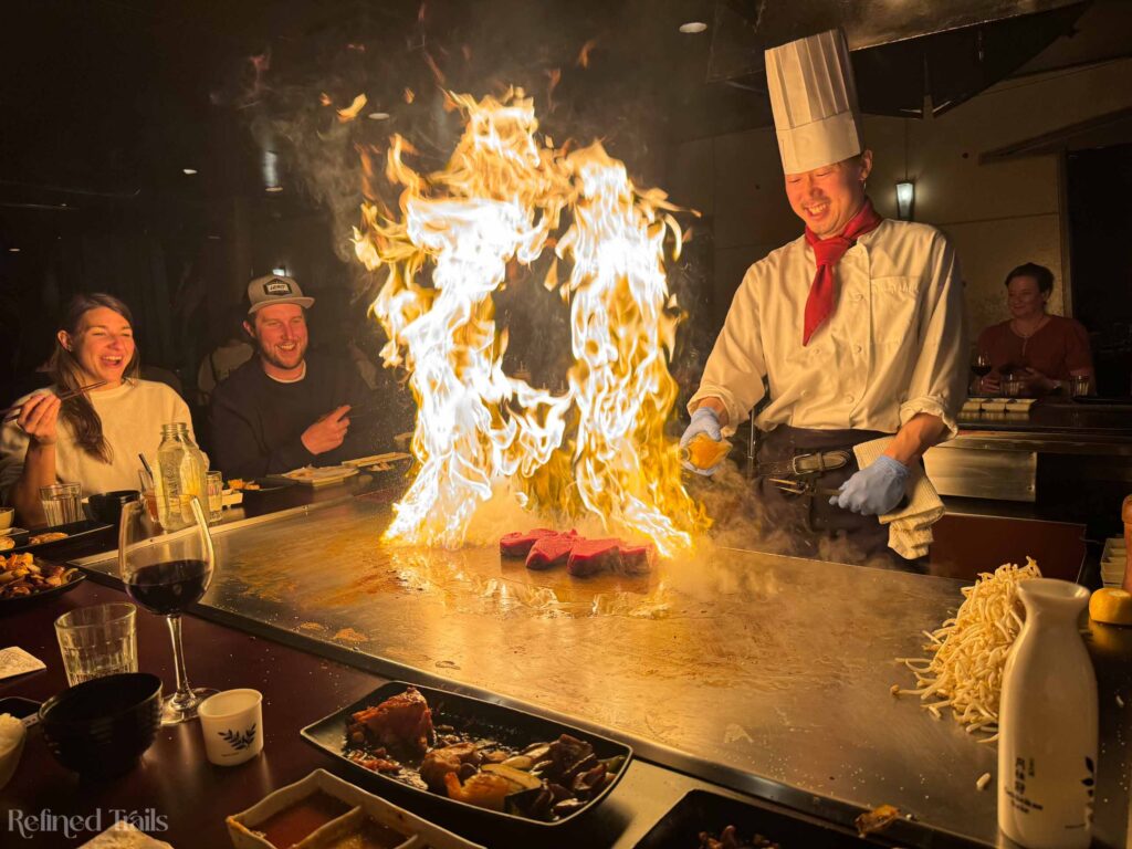 Chef cooking on the teppanyaki grill at the Teppan Village restaurant in Whistler