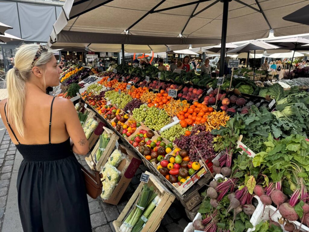 Woman standing in the food hall market in Copenhagen