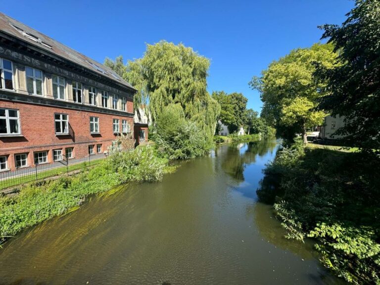 Waterway with home next to it in Odense, Denmark
