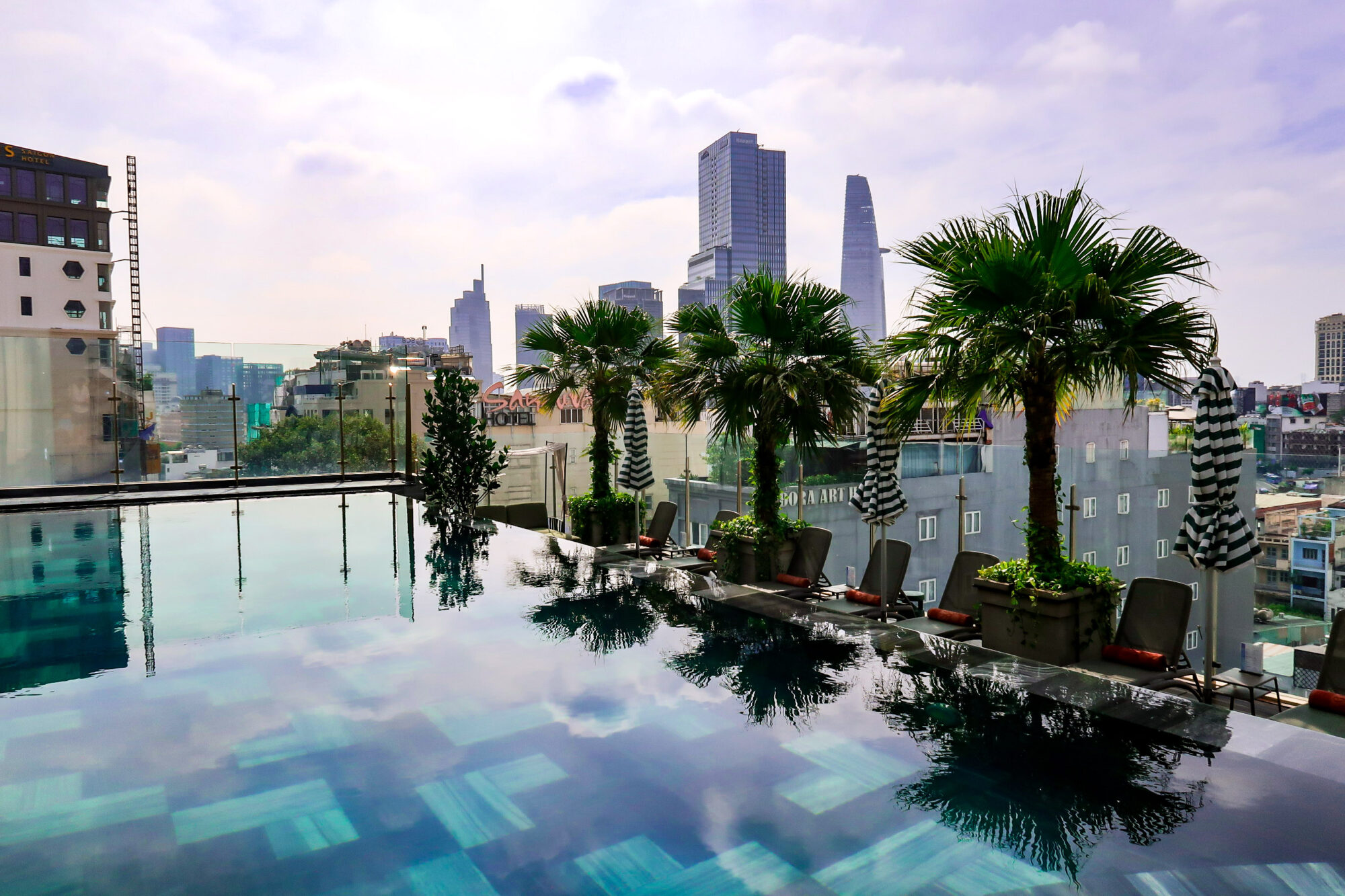 View of the La Siesta Premium Saigon rooftop pool overlooking Ho Chi Minh City