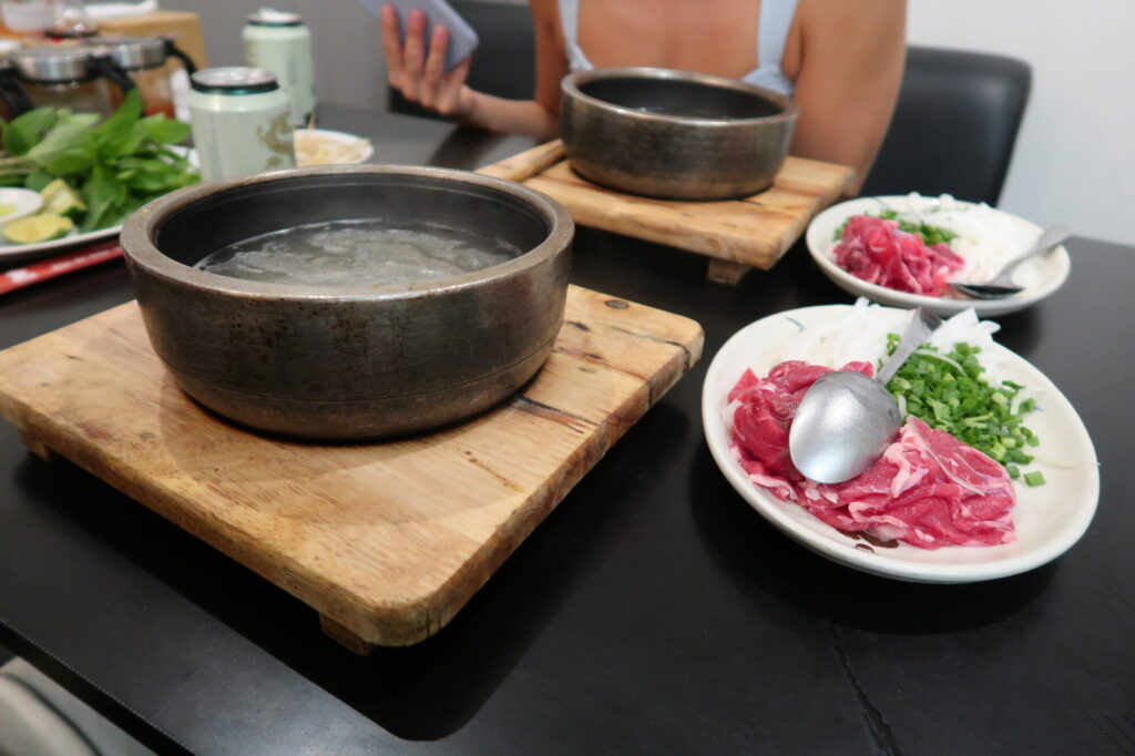 3 Days in Ho Chi Minh City: The Ultimate 72 Hour Saigon Itinerary 20 Vietnamese Beef Pho Soup with a hot bowl ready to be cooked