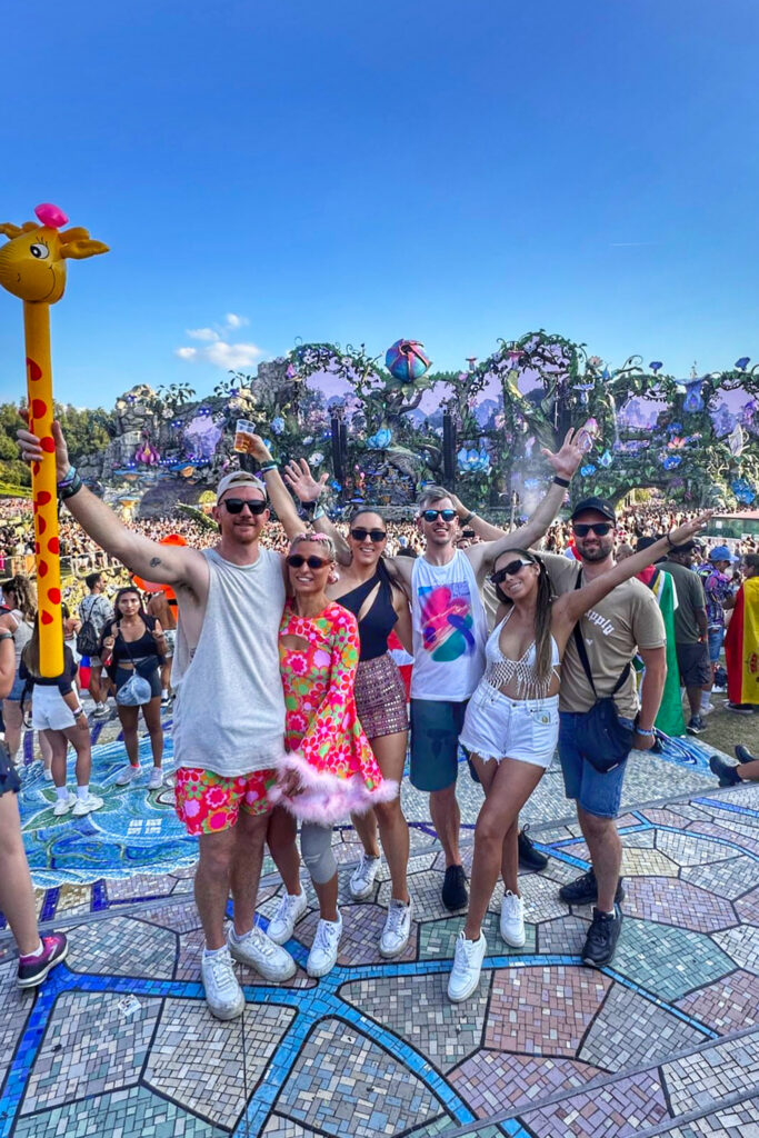 Group standing in front of Tomorrowland mainstage in 2024