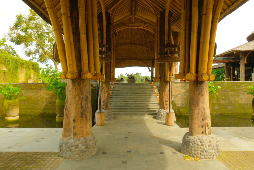 Open-air lobby with reflecting ponds and fountain at Akohara Buahan Village Retreat Bali