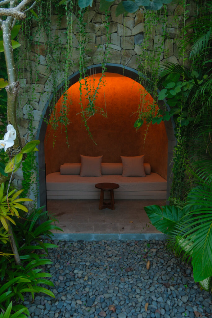 Secluded alcove cave with seating at Akohara Buahan Village Retreat Bali