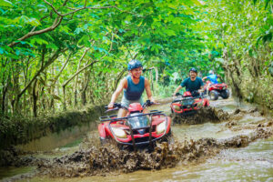 Atlasan Adventure ATV Tour in Ubud Bali driving through jungle and muddy puddles
