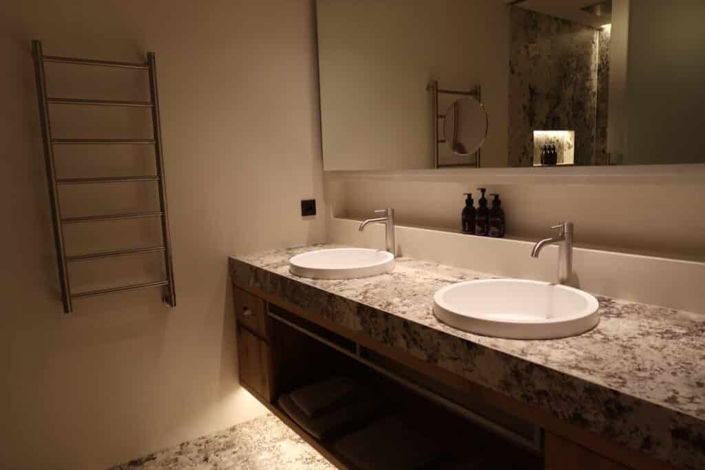 Bathroom with dual vanity at Hotel Recort in Italy