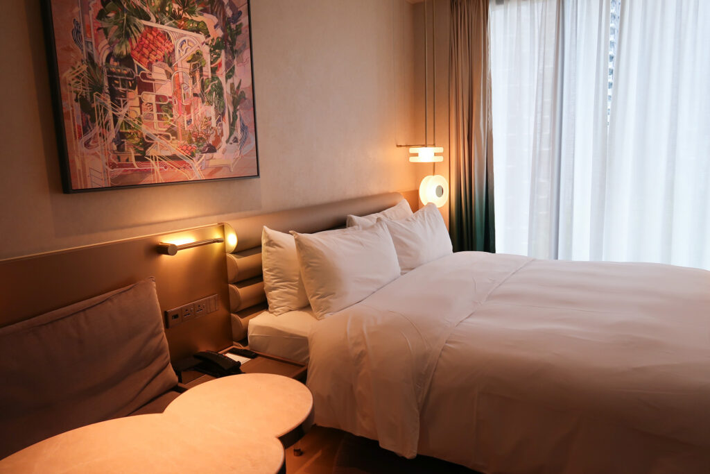 Guest bed and roomat the Mondrian Singapore Duxton hotel