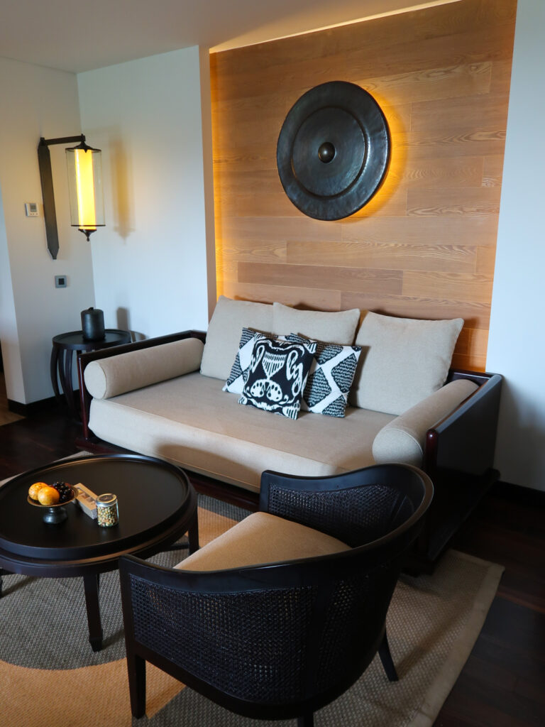 Couch and sitting area inside guest rooms at The Kempinski Bali