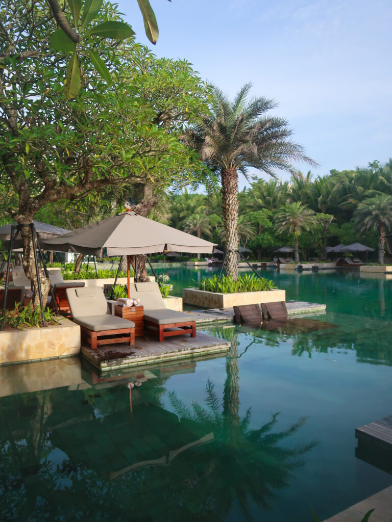 Main pool with sunlounges at The Kempinski in Bali