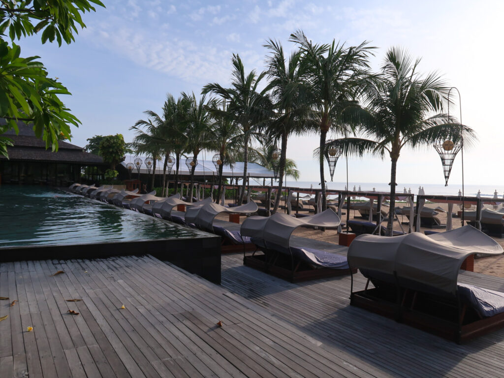 Reef beach club pool and sunlounges at The Apurva Kempinski Bali