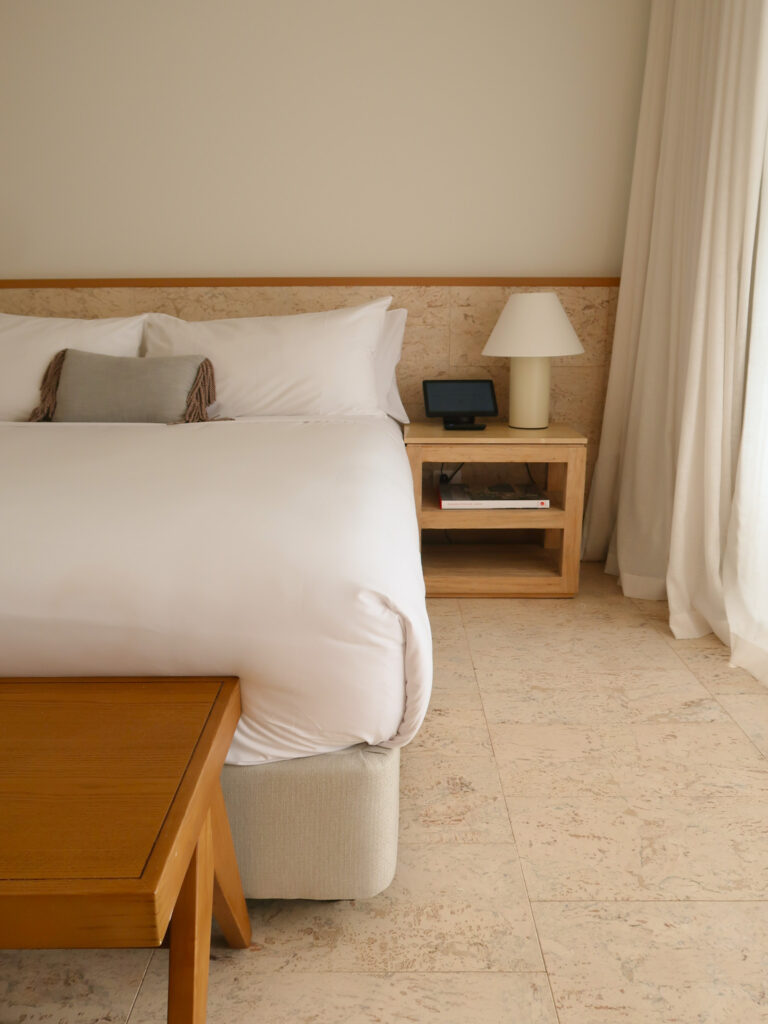 Comfortable king bed at The Lodge Wadjemup