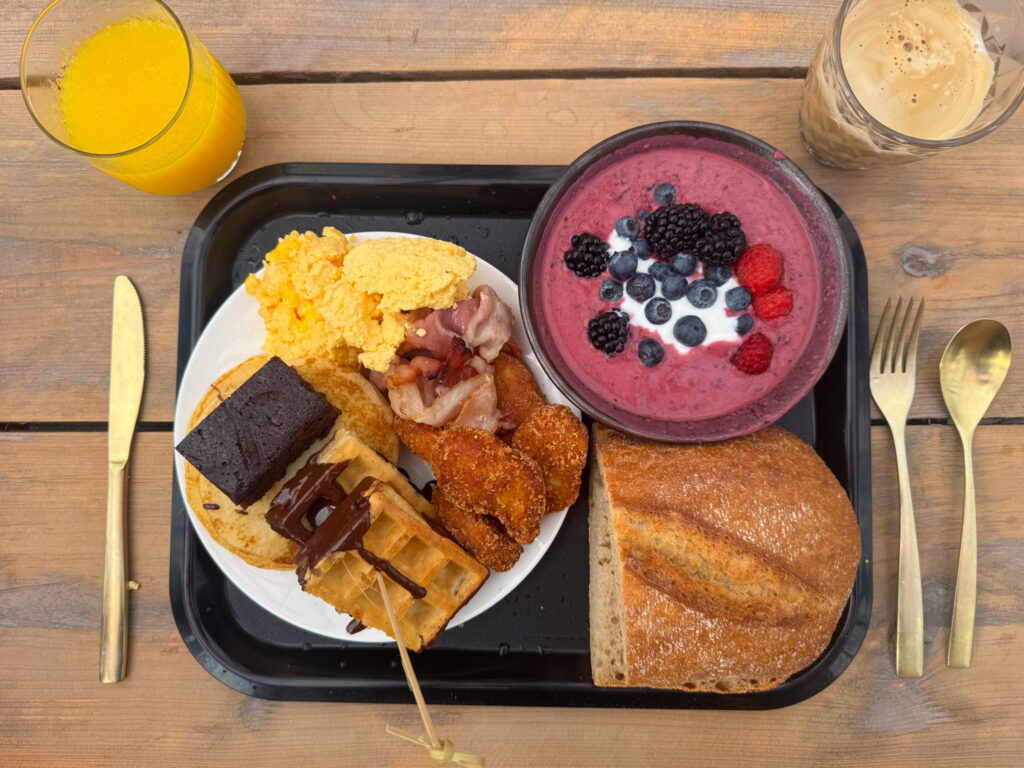 Eggs, bacon, waffles, yoghurt bowl and more food at Montagoe Breakfast in Dreamville at Tomorrowland Belgium